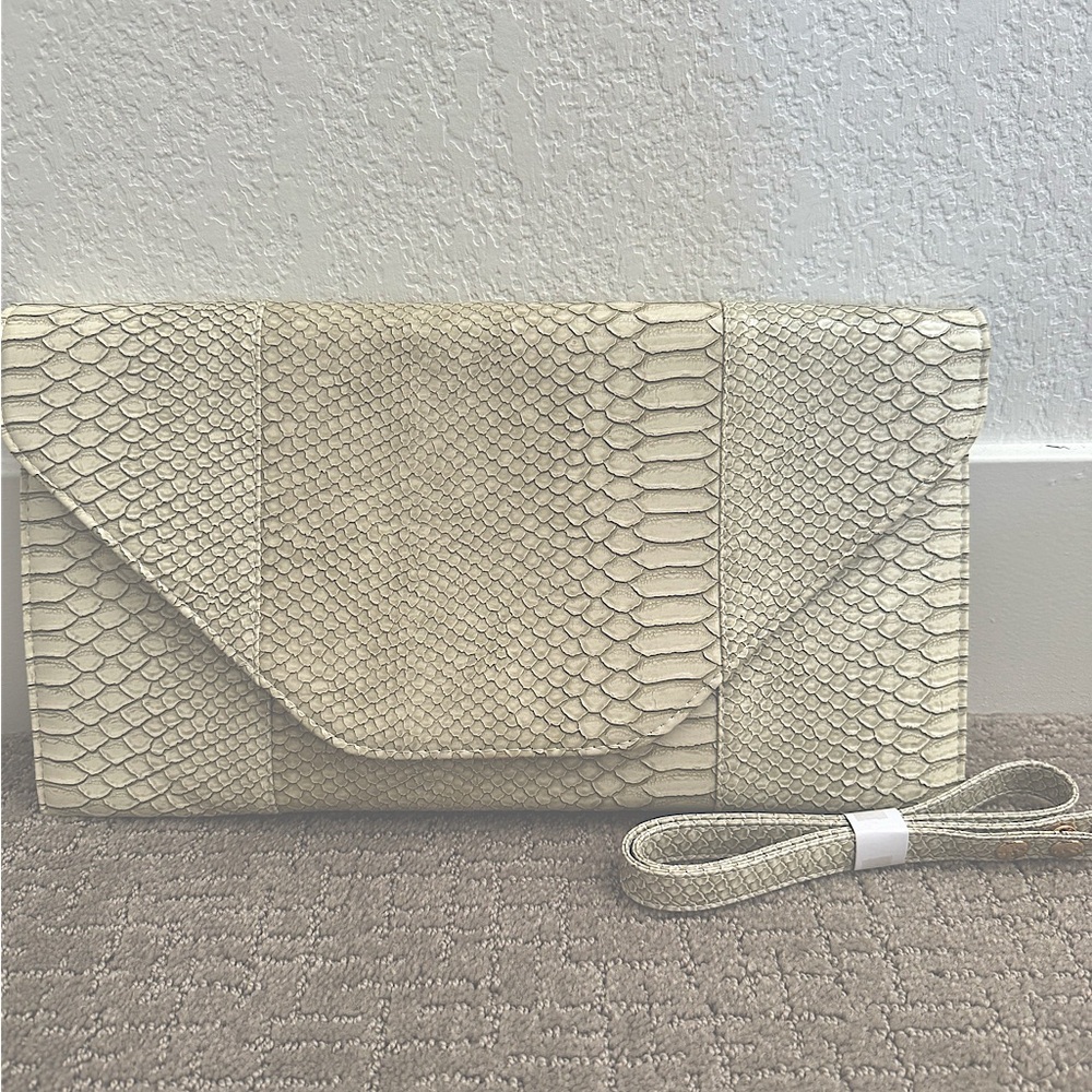 NWOT oversized clutch. Crocodile-style embossed